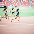 Women runners competing in track race at national stadium