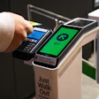 Contactless payment terminal with green 'GO' screen and blue card reader