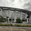SoFi Stadium exterior with large white columns and modern architectural design