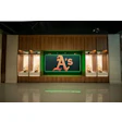 Oakland Athletics logo in green frame with World Series trophies