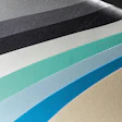 Abstract curved stripes in grayscale, blue, teal, and beige tones