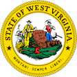 West Virginia state seal featuring two mountaineers and industrial imagery with the motto Montani Semper Liberi