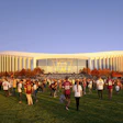 Large crowd wearing sports jerseys gathered on grass in front of modern stadium building during golden hour