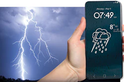 Smartphone displaying rainy weather forecast with 8°C temperature held against dramatic lightning storm background