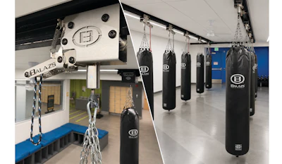 Balazs boxing gym interior with heavy bags and training equipment mounted from ceiling