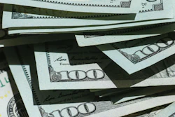Stack of U.S. hundred dollar bills fanned out showing currency details and security features