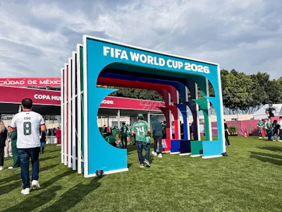 FIFA World Cup 2026 promotional booth with colorful geometric design at outdoor fan festival in Mexico City