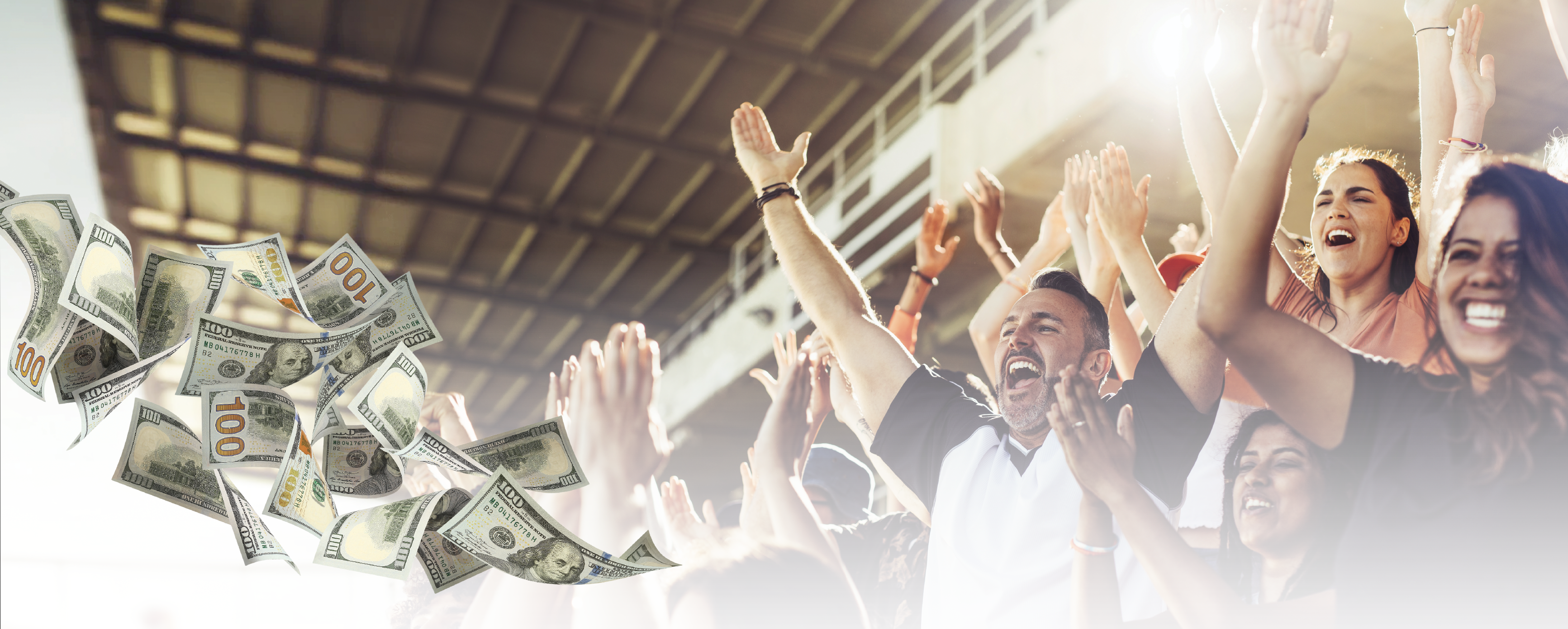 Excited group of people celebrating with arms raised as money falls around them in a bright, successful moment