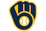 Milwaukee Brewers logo featuring a navy blue baseball glove with gold outline and white baseball
