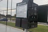 Sports Kiosk equipment station at baseball field with instructional signage and Cherokee Nation branding
