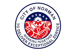 City of Norman official seal featuring red floral design with 'Working Together Delivering Exceptional Service' motto
