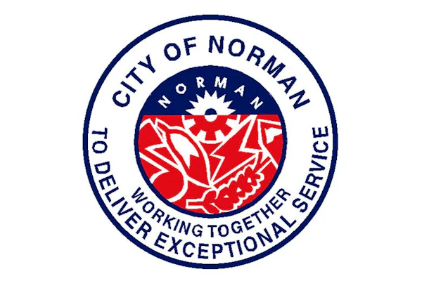 City of Norman official seal featuring red floral design with 'Working Together Delivering Exceptional Service' motto