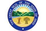 Great Seal of the State of Ohio featuring a circular blue border with gold text, central landscape with rising sun, mountains, and wheat sheaf