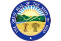 Great Seal of the State of Ohio featuring a circular blue border with gold text, central landscape with rising sun, mountains, and wheat sheaf